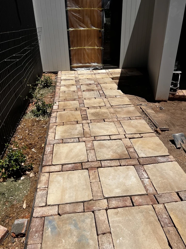 Stone paving leading to a timber front door