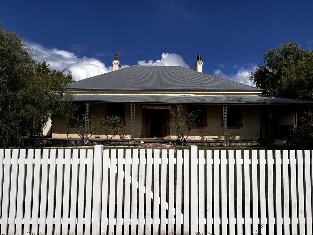 White picket frontage and garden gate