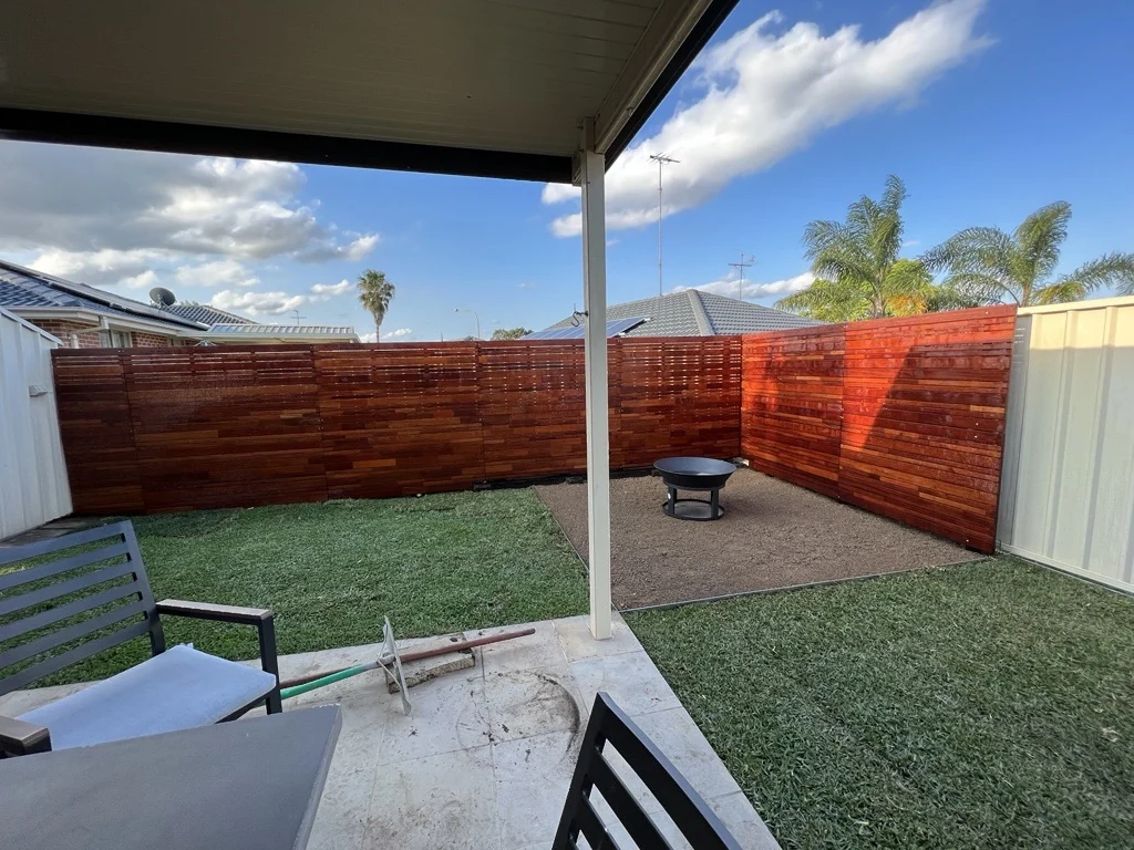 Horizontal timber fencing around an outdoor sitting area
