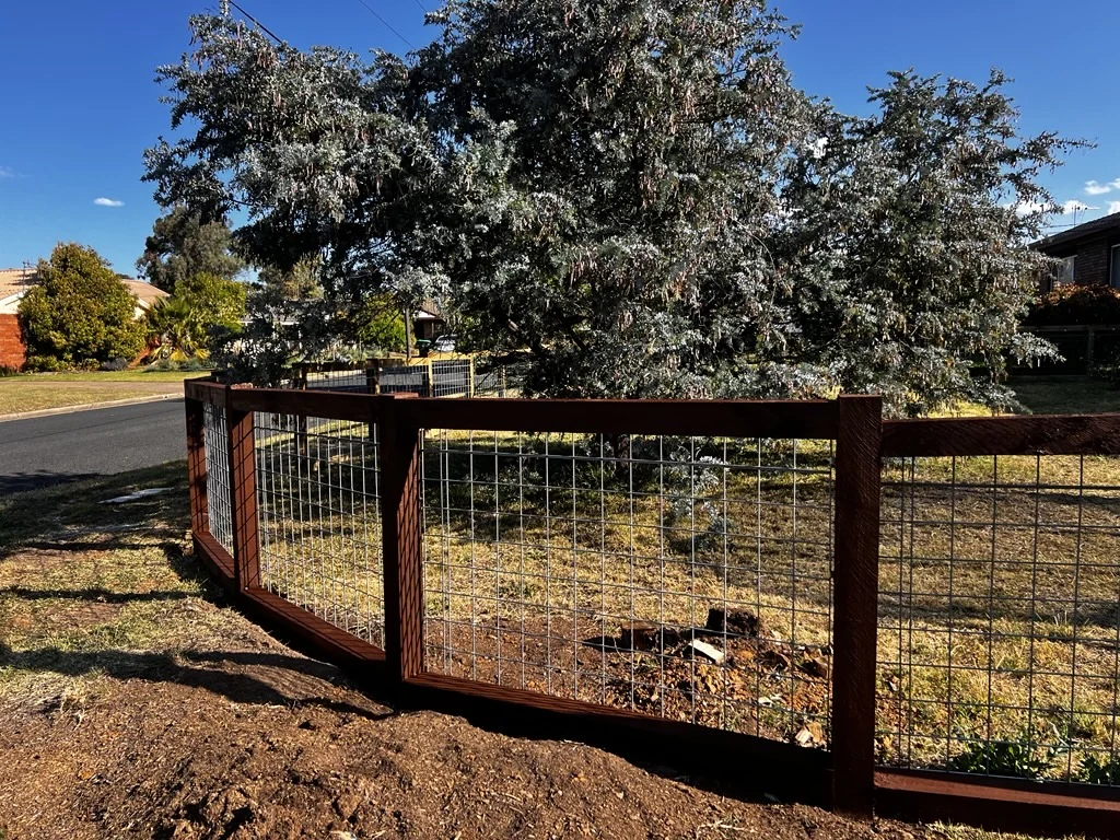 Timber and wire garden gate with matching fence